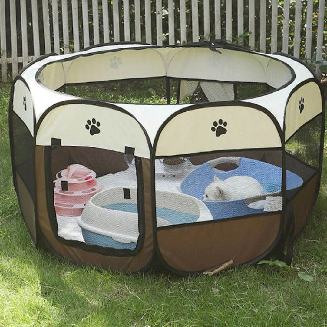 Pet playpen set up outdoors on grass